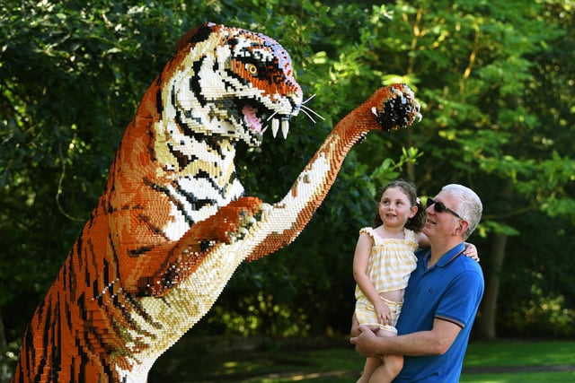 Shaun Dale with his granddaughter Daisy Hugill and a Bengal tiger