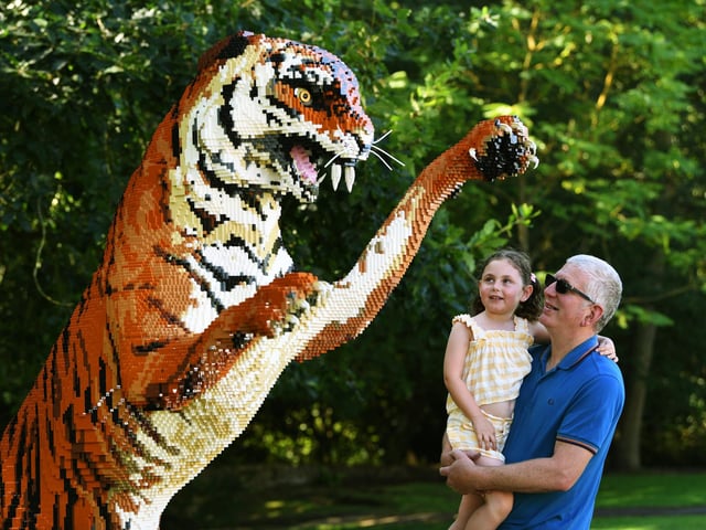 Shaun Dale with his granddaughter Daisy Hugill and a Bengal tiger
