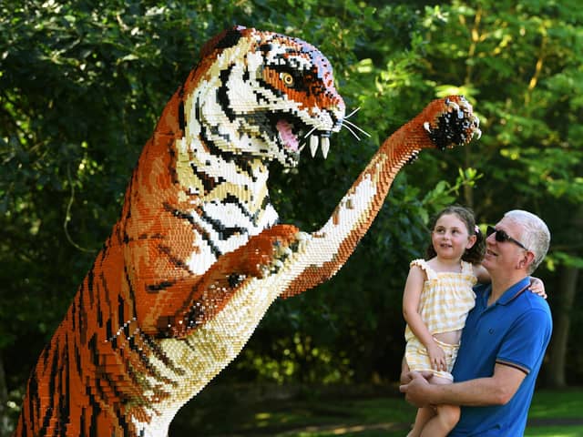 Shaun Dale with his granddaughter Daisy Hugill and a Bengal tiger