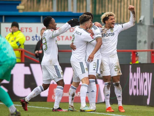GOING THROUGH: Leeds United celebrate Junior Firpo's strike at Accrington. Picture by Bruce Rollinson