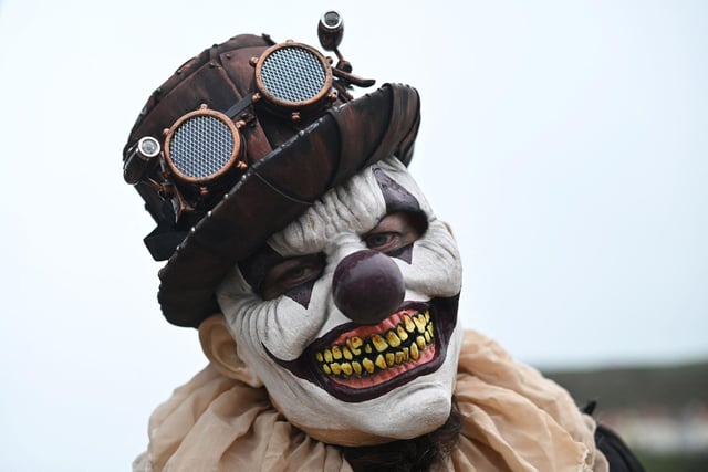 Thousands can be seen wearing masks and makeup at this year's festival.