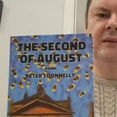 Peter J Donnelly with his debut chapbook The Second of August