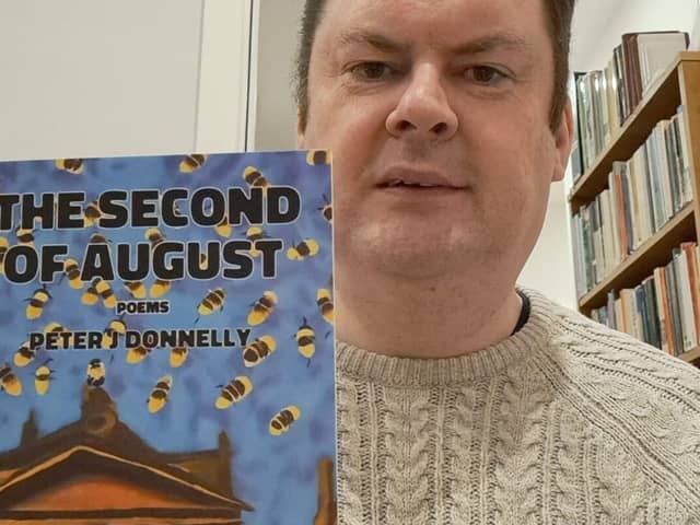 Peter J Donnelly with his debut chapbook The Second of August