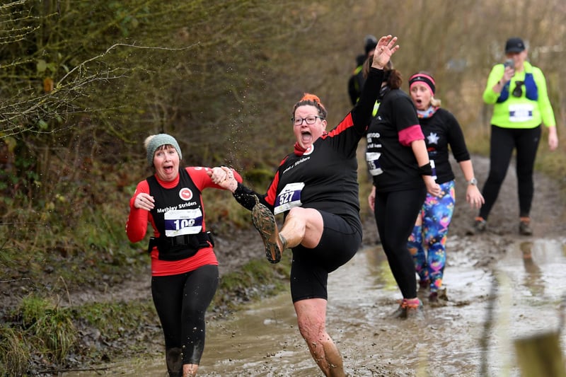 Runners tackle the notorious 'puddle of doom' on the Temple Newsam Ten course
