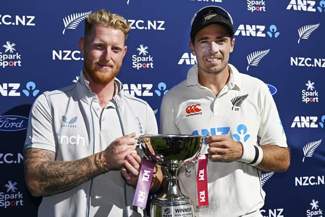 HONOURS EVEN: England's captain Ben Stokes, left, and his New Zealand counterpart Tim Southee share the trophy after the drawn two-game test series after New Zealand won by one run on day five in Wellington Picture: Andrew Cornaga/Photosport via AP