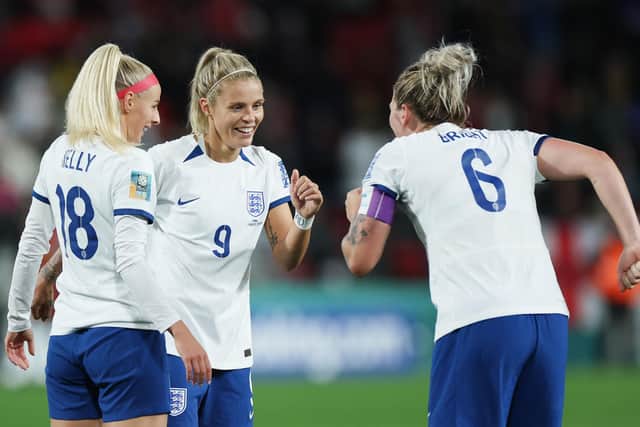 England's Rachel Daly celebrates scoring their side's sixth goal of the game with team-mates Millie Bright, right, and Chloe Kelly, left (Picture: Isabel Infantes/PA Wire)