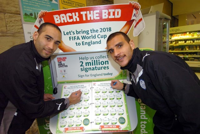 Sheffield Wednesday players Lee Grant (left) and Marcus Tudgay sign the 2018 World Cup Bid Book.