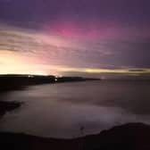 Stunning capture of purple and green Northern Lights off Scarborough's Scalby clifftops.
