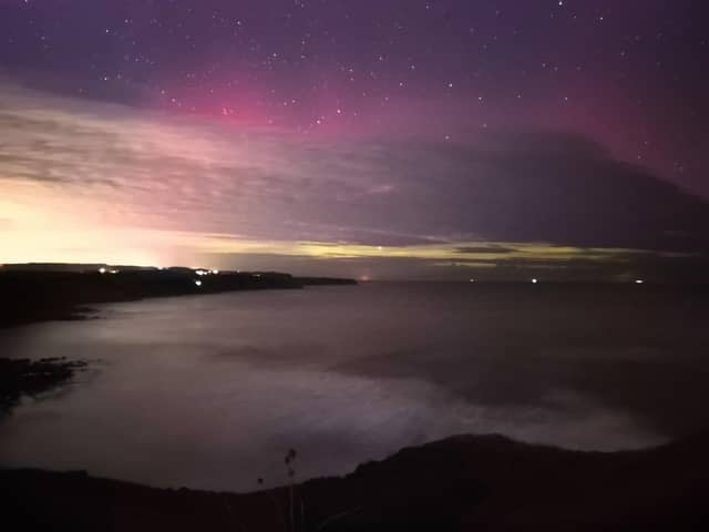 Stunning capture of purple and green Northern Lights off Scarborough's Scalby clifftops.