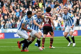 Huddersfield Town's Tom Lees celebrates opening the scoring against Yorkshire rivals Hull City in the fixture at the John Smith's Stadium last season. Picture: Jonathan Gawthorpe