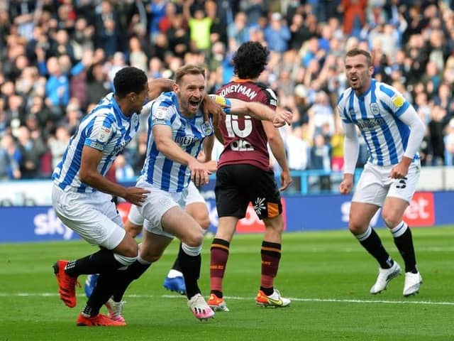 Huddersfield Town's Tom Lees celebrates opening the scoring against Yorkshire rivals Hull City in the fixture at the John Smith's Stadium last season. Picture: Jonathan Gawthorpe