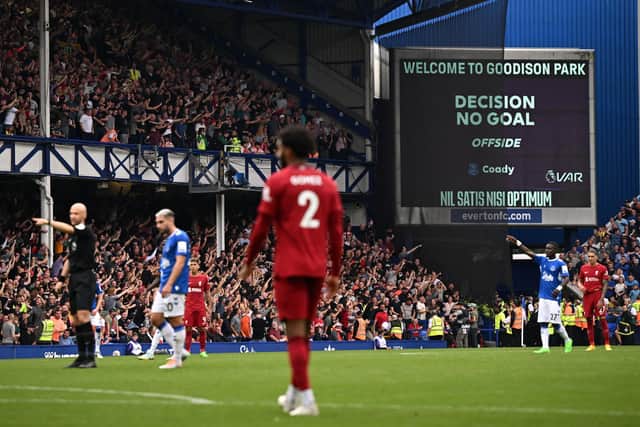 After a VAR (Video Assistant Referee) review, Everton's English defender Conor Coady has his goal disallowed for offside during the English Premier League football match between Everton and Liverpool at Goodison Park in Liverpool. Picture: OLI SCARFF/AFP via Getty Images.