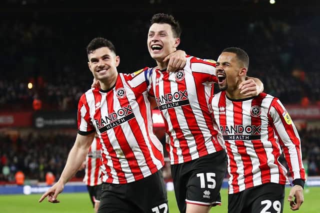Anel Ahmedhodzic (C) of Sheffield United celebrates with teammates John Egan (L) and Iliman Ndiaye (R) after scoring the team's second goal (Picture: George Wood/Getty Images)