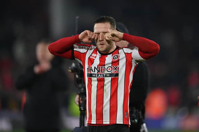 SHEFFIELD, ENGLAND - FEBRUARY 07: Billy Sharp of Sheffield United, simulates crying as they taunt fans of Wrexham following their side's defeat, during the Emirates FA Cup Fourth Round Replay match between Sheffield United and Wrexham at Bramall Lane on February 07, 2023 in Sheffield, England. (Photo by Michael Regan/Getty Images)
