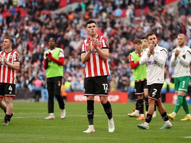 John Egan of Sheffield United  applauds the fans after the team's defeat in the FA Cup Semi Final match between Manchester City and Sheffield United at Wembley Stadium (Picture: Julian Finney/Getty Images)