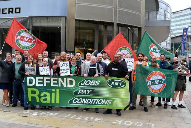 Members of the RMT stand on a picket line outside Manchester Piccadilly train station during the national rail strike over pay on August 18, 2022 in Manchester, England. PIC: Anthony Devlin/Getty Images