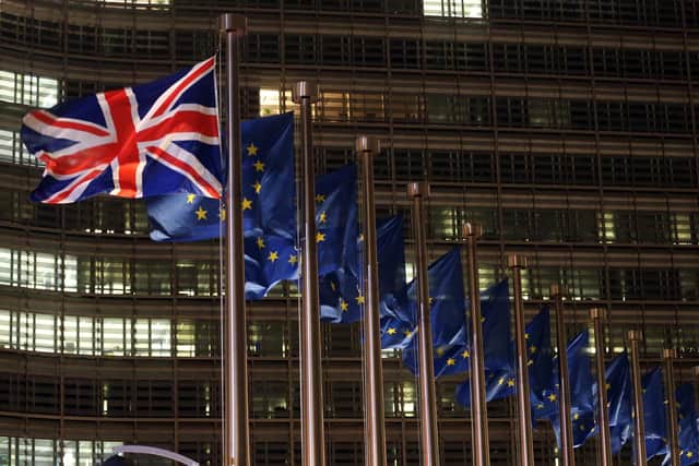 British and European flags fluttering outside the Berlaymont building, the European commission headquarters in December 2020. PIC: FRANCOIS WALSCHAERTS/AFP via Getty Images