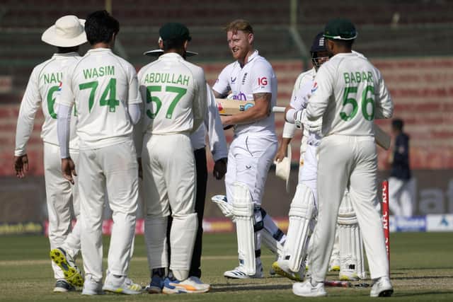 ON THE UP: England captain Ben Stokes, center, shakes hand with Pakistani players after winning the third test cricket match against Pakistan, in Karachi Picture: AP Photo/Fareed Khan