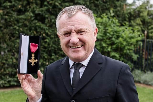 Mike Downey with his OBE medale. Picture by Samir Ceric Kovacevic.
