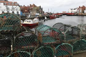 Crab and Lobster pots  stacked high on the quayside of Whitby harbour