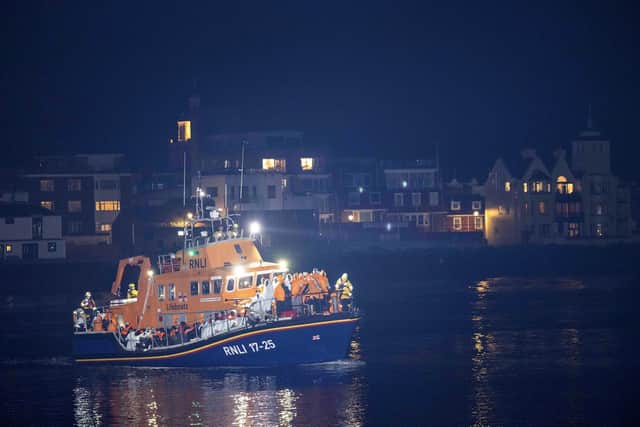 A group of people thought to be migrants are brought in to a marina by the RNLI following a small boat incident in the Channel. PIC Trevor Adams/PA Wire