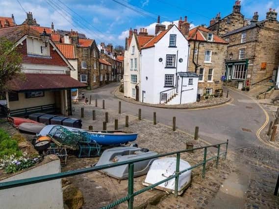 These are the best places to go for a springtime walk in the UK. Pictured is Robin Hood's Bay.