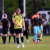 BOWING OUT: George Thomson, Harrogate Town's longest-serving player, at full-time on Saturday (Image: Ben Roberts Photo/Getty Images)