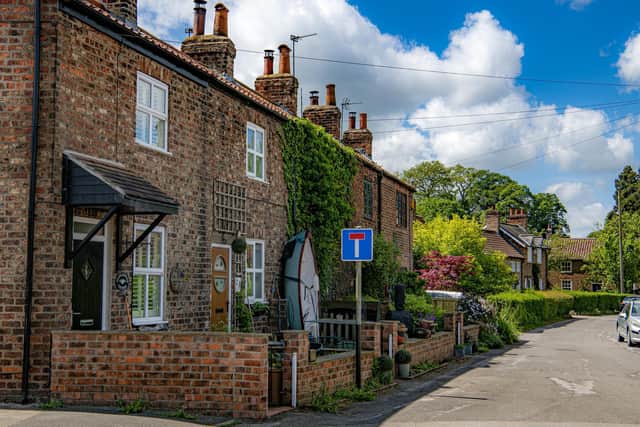 The mix of traditional cottages, grander houses and sensitive new development makes for quintessential and quaint kerb appeal in Naburn. Photographed by Tony Johnson for The Yorkshire Post.  25th May 2023