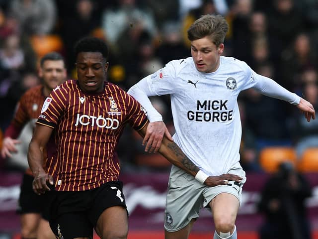Bradford's Josh Neufville takes on Peterborough's Jimmy-Jay Morgan. (Picture: Jonathan Gawthorpe)