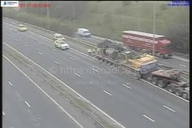 Police and highways officers on the M62 westbound, near junction 33 for Ferrybridge Services, after a vehicle hit a bridge (Photo: Motorwaycameras.co.uk)