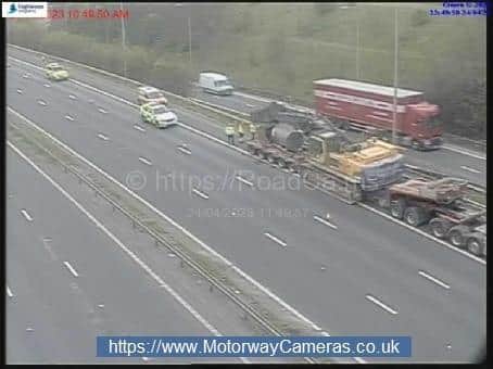Police and highways officers on the M62 westbound, near junction 33 for Ferrybridge Services, after a vehicle hit a bridge (Photo: Motorwaycameras.co.uk)