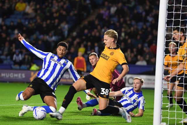 Cambridge United keeper Jake Eastwood denies Sheffield Wednesday's Mason Burstow. Picture: Steve Ellis