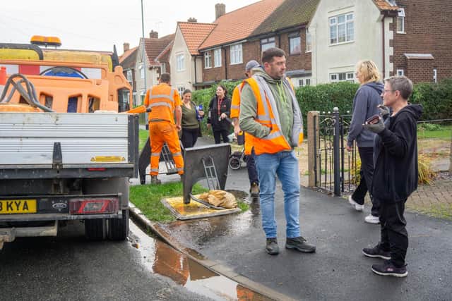 MS3 contractors speak with local during a standoff between MS3 contractors and people in Westlands Drive, Hedon, East Riding of Yorkshire during works to install broadband poles,