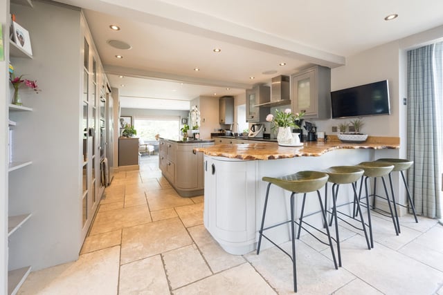 The open plan kitchen-dining room has been beautifully designed with plenty of storage.