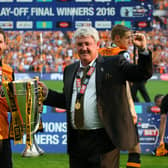 LONDON, ENGLAND - MAY 28:  Father and son Alex Bruce and Steve Bruce, manager of Hull City celebrate with the trophy after the Sky Bet Championship Play Off Final match between Hull City and Sheffield Wednesday at Wembley Stadium on May 28, 2016 in London, England.  (Photo by Alex Livesey/Getty Images)