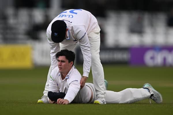 Hard lines, old boy. Ali Orr, of Sussex, is helped to his feet by team-mate Tom Clark after twice dropping Yorkshire's Fin Bean off England pace bowler Ollie Robinson. Photo by Mike Hewitt/Getty Images.