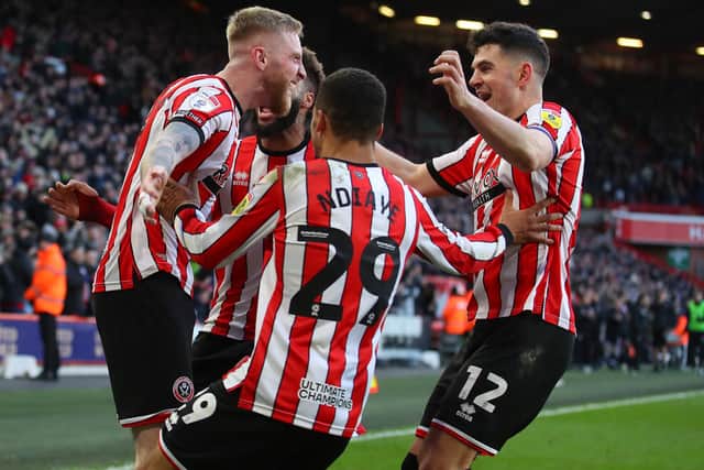 DECISIVE MOMENT: Sheffield United player celebrate Ryan Porteous' own goal