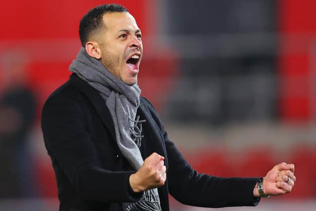 CHARACTER TEST: Hull City coach Liam Rosenior celebrates with the away fans at Rotherham United on Tuesday