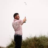 Making his mark: Alex Fitzpatrick tees off in the pouring rain on the 13th hole on the final day of the Open at Royal Liverpool.(Picture: Gregory Shamus/Getty Images)