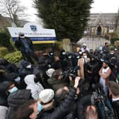 Protesters give a statement to members of the media outside Batley Grammar School in Batley. PIC: PA