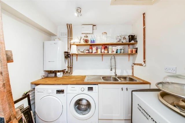 The utility room makes sure the washing machine, boiler and dryer are out of sight.