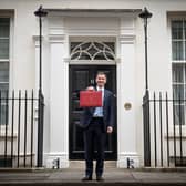 Chancellor of the Exchequer Jeremy Hunt leaves 11 Downing Street, London, with his ministerial box before delivering his Budget at the Houses of Parliament. Stefan Rousseau/PA Wire