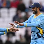 All smiles for Yorkshire captain Shan Masood, right, and Dan Moriarty as the club gains its first victory of the season. Photo by Stu Forster/Getty Images.