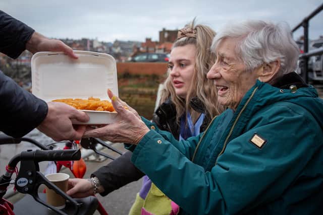 Marjory Hart enjoys fish and chips in Whitby with staff from The Mayfield Care Home. Picture: Scott Wicking.