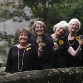 Calendar Girls Roz Fawcett, Angela Baker, Lynda Logan, Beryl, Bamforth, Tricia Stewart, and calendar photographer Terry Logan, celebrate reaching £1m for Leukeamia Research, after an anonymous donor  from the South of France topped up their total.