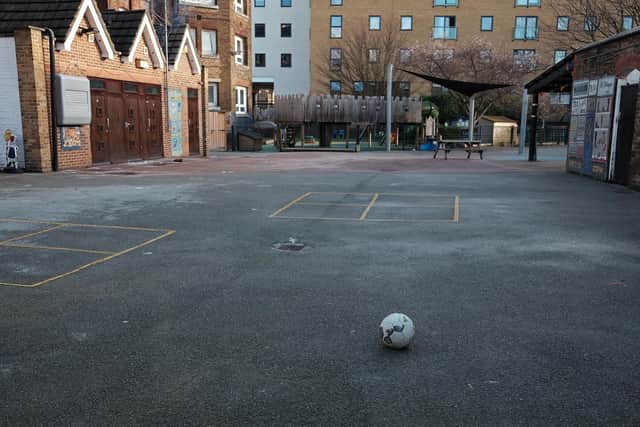 A football lies on the empty playground of a primary school. PIC: PA