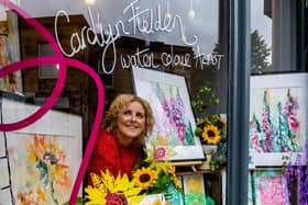 The Hebden Bridge Open Studios Window Trail 2023. Pictured Artist Carolyn Fielden showing her works in the window of Spring Tuition, West End, Hebden Bridge. Picture By Yorkshire Post Photographer,  James Hardisty.