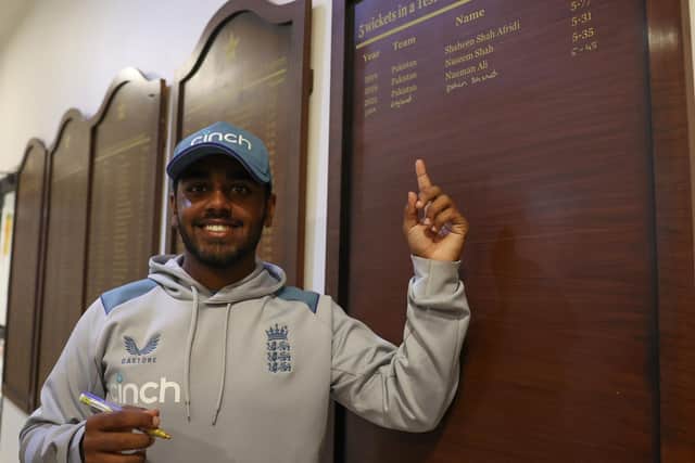 A great honour: Rehan Ahmed pictured after signing his name on the honours board at Karachi's National Stadium. Photo by Matthew Lewis/Getty Images.