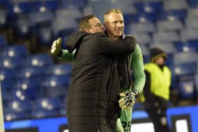 Goalkeepers; union: Cameron Dawson after his penalty save in injury time is hugged by David Stockdale at the final whistle (Picture: Steve Ellis)