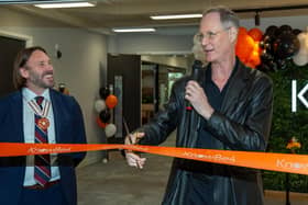 Stu Sjouwerman, founder and CEO of KnowBe4 (right), cuts a ribbon at the opening ceremony of KnowBe4's new Leeds office. Photo: Roth Read Photography.